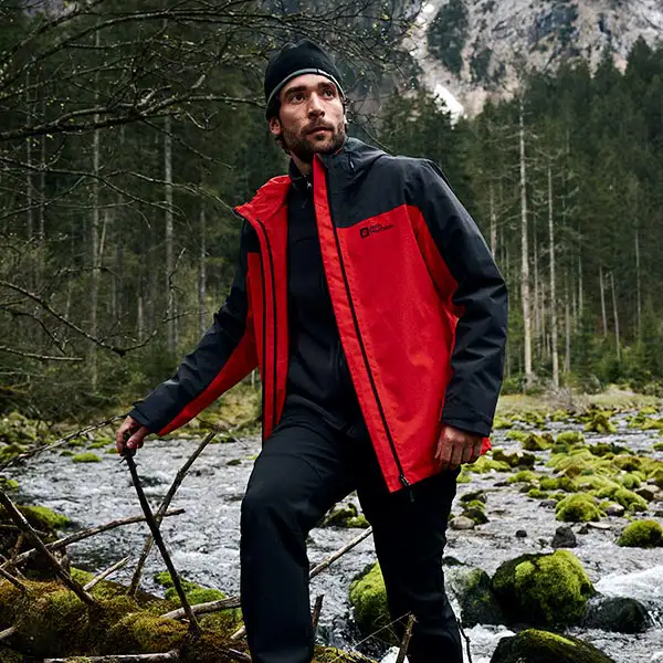 Man wearing jacket in forest