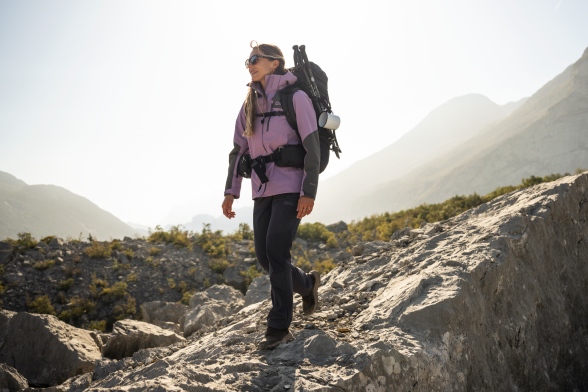 Woman in a spring trekking outfit in the mountains