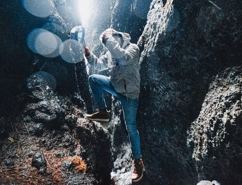 Andre in front of a rock